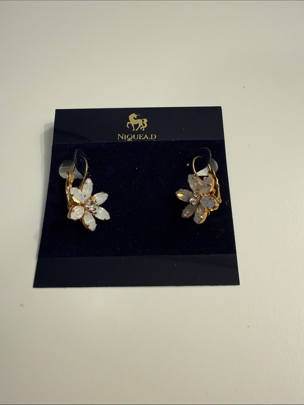 Nique Gold Floral Crystal Drop Earrings in White and Gold
